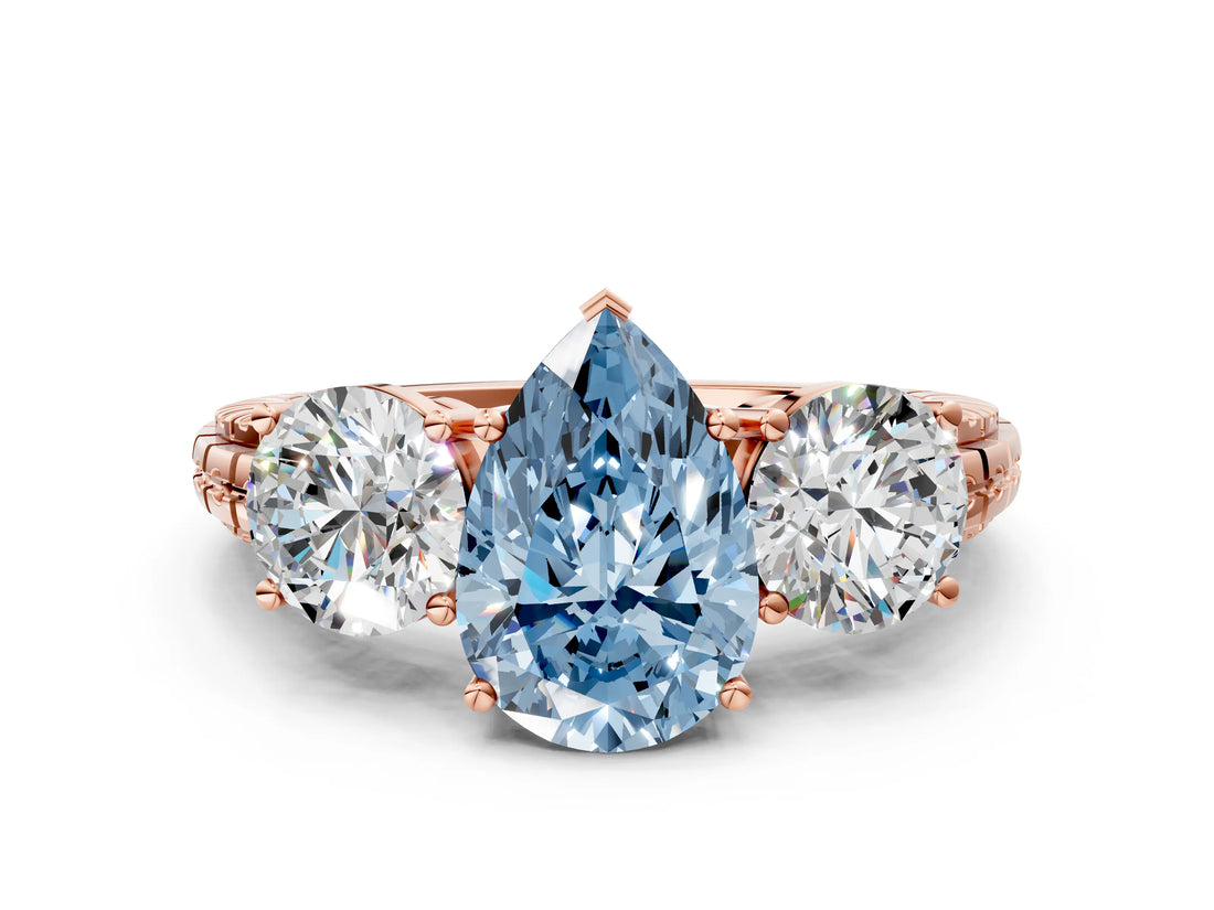 Rose gold Three-Stone Fancy Blue Pear Cut Cut Diamond Ring with Channel-Set Band and Prong Setting