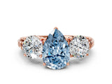 Rose gold Three-Stone Fancy Blue Pear Cut Cut Diamond Ring with Channel-Set Band and Prong Setting