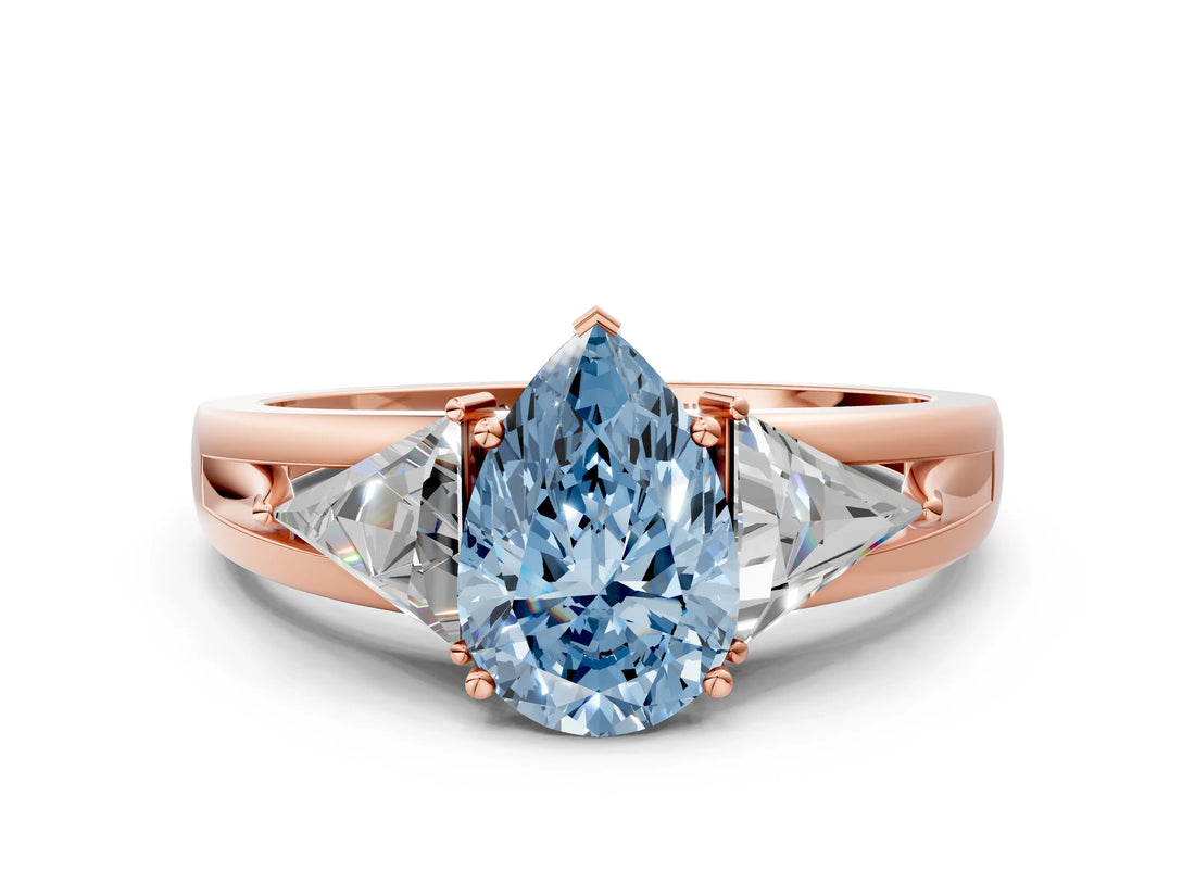 Rose gold Three-Stone Fancy Blue Pear Cut Cut Diamond Ring with Trillion Side Stones on a Split Shank Band