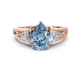 Rose gold Three-Stone Fancy Blue Pear Cut Cut Diamond Ring with Trillion Side Stones on a Split Shank Band