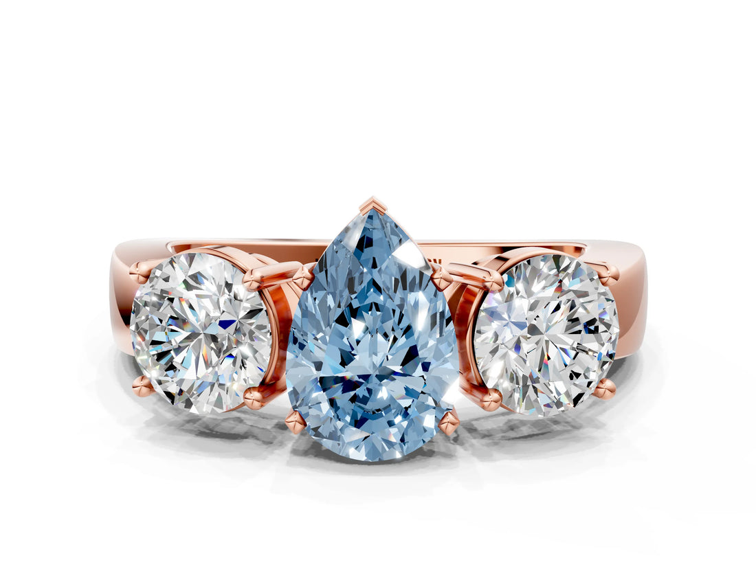 Rose gold Three-Stone Fancy Blue Pear Cut Diamond Ring with Round Side Stones, Classic Band, and Four-Prong Setting