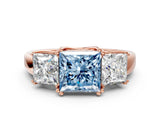Rose gold Three-Stone Fancy Blue Princess Cut Cut Diamond Ring with Channel Set Band and Four-Prong Setting