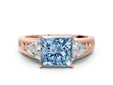Rose gold Three-Stone Fancy Blue Princess Cut Cut Diamond Ring with Trillion Side Stones on a Split Shank Band