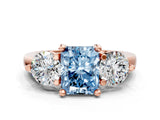 Rose gold Three-Stone Fancy Blue Radiant  Brilliant Cut Solitaire Ring with Prong Setting on a Classic Band