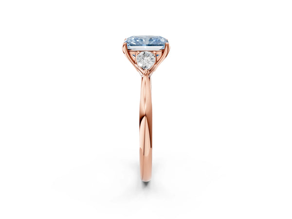 Rose gold Three-Stone Fancy Blue Radiant Cut Brilliant Diamond Solitaire Ring with Tapered Band and Four-Prong Setting