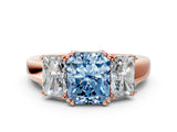 Rose gold Three-Stone Fancy Blue Radiant Cut Cut Diamond Ring with Channel Set Band and Four-Prong Setting