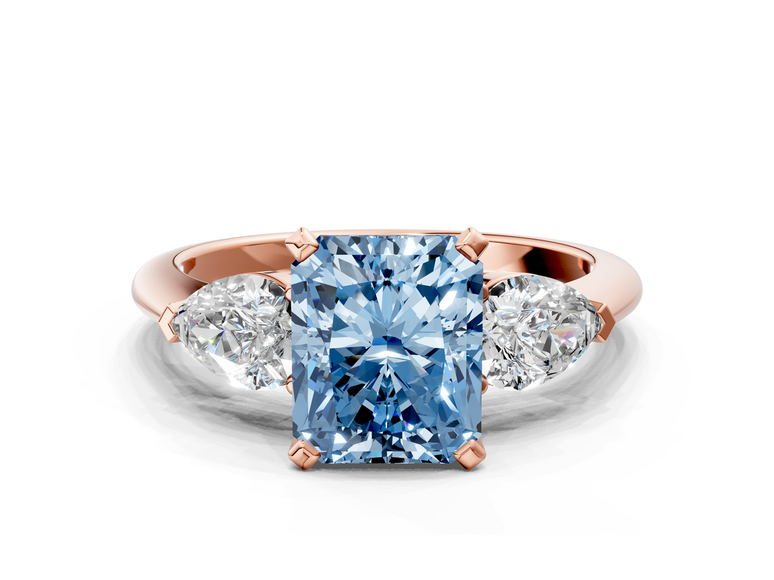 Rose gold Three-Stone Fancy Blue Radiant  Diamond Ring with Pear Side Stones in Four-Prong Setting_59