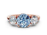 Rose gold Three-Stone Fancy Blue Round Cut Cut Diamond Ring with Channel Set Band and Four-Prong Setting