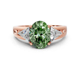 Rose gold Three-Stone Fancy Green Oval Cut Cut Diamond Ring with Trillion Side Stones on a Split Shank Band