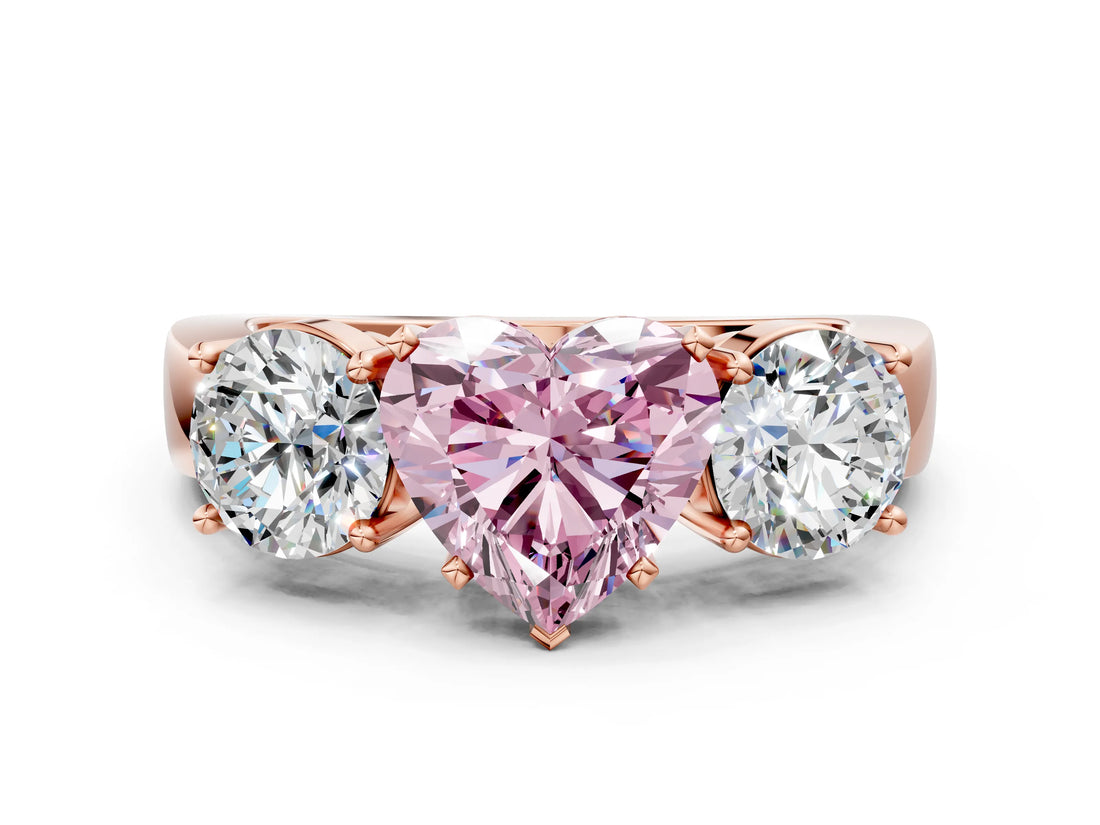 Rose gold Three-Stone Fancy Pink Heart Cut Diamond Ring with Round Side Stones, Classic Band, and Four-Prong Setting