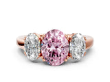 Rose gold Three-Stone Fancy Pink Oval Cut Cut Diamond Ring with Channel Set Band and Four-Prong Setting
