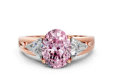 Rose gold Three-Stone Fancy Pink Oval Cut Cut Diamond Ring with Trillion Side Stones on a Split Shank Band