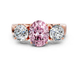 Rose gold Three-Stone Fancy Pink Oval Cut Diamond Ring with Round Side Stones, Classic Band, and Four-Prong Setting