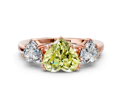 Rose gold Three-Stone Fancy Yellow Heart Cut Cut Diamond Ring with Channel Set Band and Four-Prong Setting
