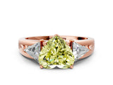 Rose gold Three-Stone Fancy Yellow Heart Cut Cut Diamond Ring with Trillion Side Stones on a Split Shank Band