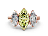 Rose gold Three-Stone Fancy Yellow Marquise Cut Cut Diamond Ring with Channel Set Band and Four-Prong Setting