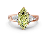 Rose gold Three-Stone Fancy Yellow Marquise Cut Cut Diamond Ring with Trillion Side Stones on a Split Shank Band