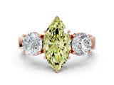 Rose gold Three-Stone Fancy Yellow Marquise Cut Diamond Ring with Round Side Stones, Classic Band, and Four-Prong Setting