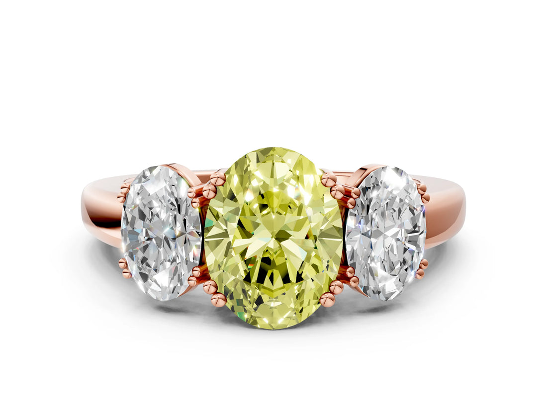 Rose gold Three-Stone Fancy Yellow Oval Cut Cut Diamond Ring with Channel Set Band and Four-Prong Setting