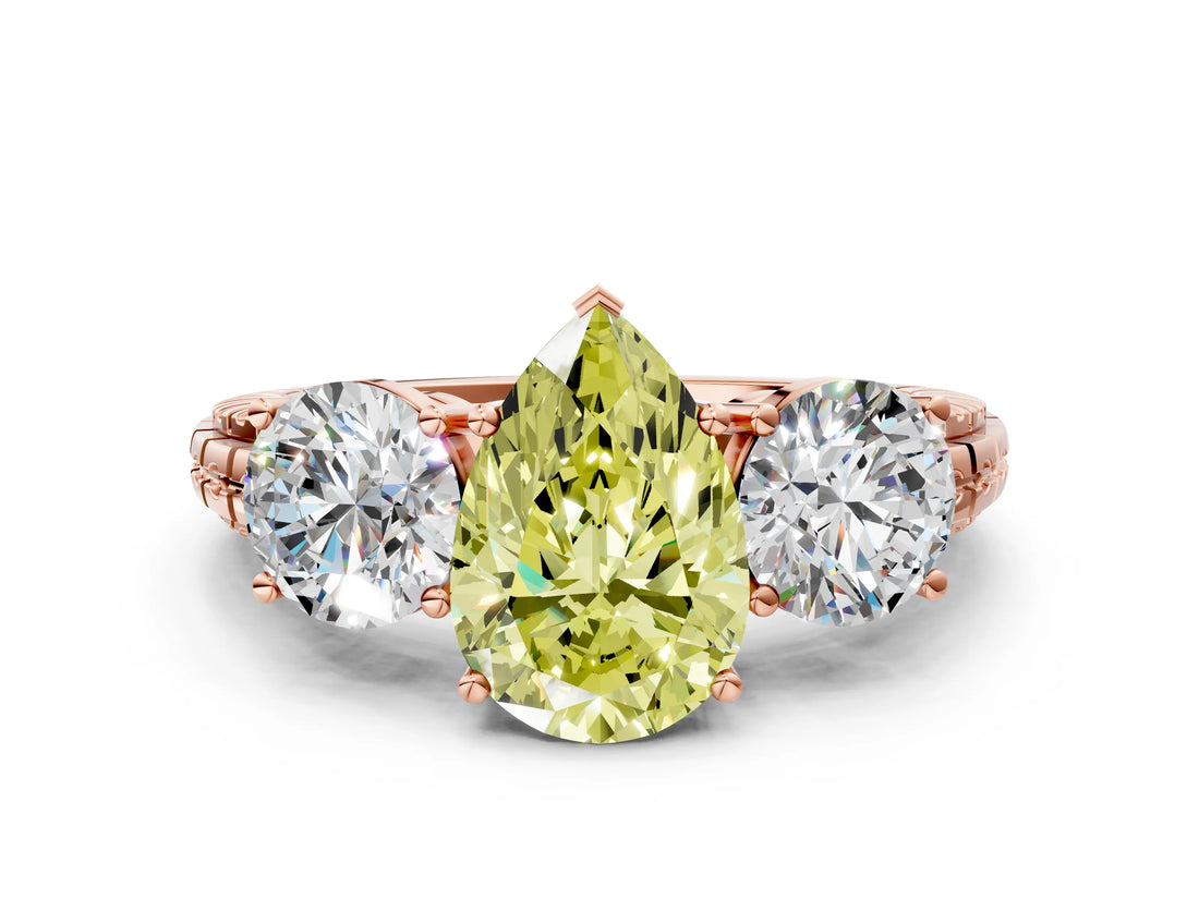 Rose gold Three-Stone Fancy Yellow Pear Cut Cut Diamond Ring with Channel-Set Band and Prong Setting