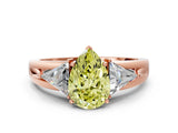 Rose gold Three-Stone Fancy Yellow Pear Cut Cut Diamond Ring with Trillion Side Stones on a Split Shank Band
