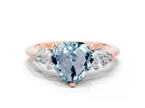 Rose gold Three-Stone Heart Cut Aquamarine Ring with Pear Side Stones and Four-Prong Setting