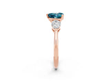 Rose gold Three-Stone Heart Cut Blue Topaz Ring with Pear Side Stones and Four-Prong Setting_2
