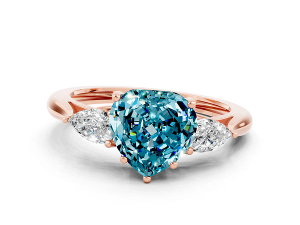Rose gold Three-Stone Heart Cut Blue Topaz Ring with Pear  Side Stones in Four-Prong Setting
