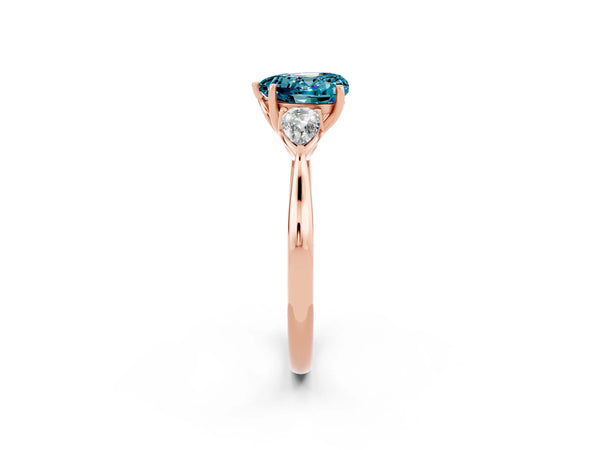 Rose gold Three-Stone Heart Cut Blue Topaz Ring with Pear  Side Stones in Four-Prong Setting