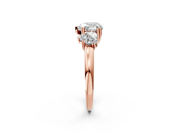 Rose gold Three-Stone Heart Cut Cut Diamond Ring with Channel Set Band and Four-Prong Setting