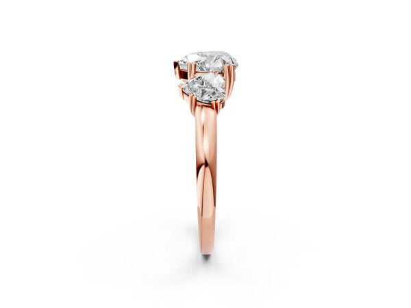 Rose gold Three-Stone Heart Cut Cut Diamond Ring with Channel Set Band and Four-Prong Setting