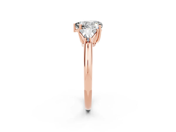 Rose gold Three-Stone Heart Cut Moissanite Engagement Ring with Trillion Side Stones and Prong Setting