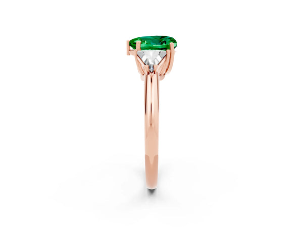 Rose gold Three-Stone Heart Cut Emerald Engagement Ring with Trillion Side Stones and Prong Setting