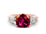 Rose gold Three-Stone Heart Cut Cut Diamond Ring with Trillion Side Stones and Four-Prong Setting