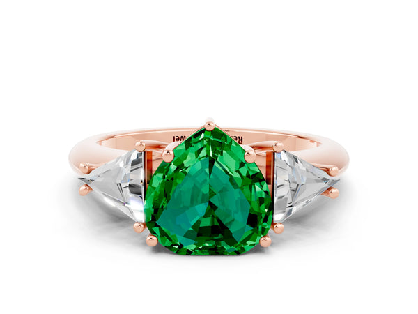 Rose gold Three-Stone Heart Cut Emerald Engagement Ring with Trillion Side Stones and Prong Setting