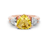 Rose gold Three-Stone Heart Cut Cut Diamond Ring with Trillion Side Stones and Four-Prong Setting