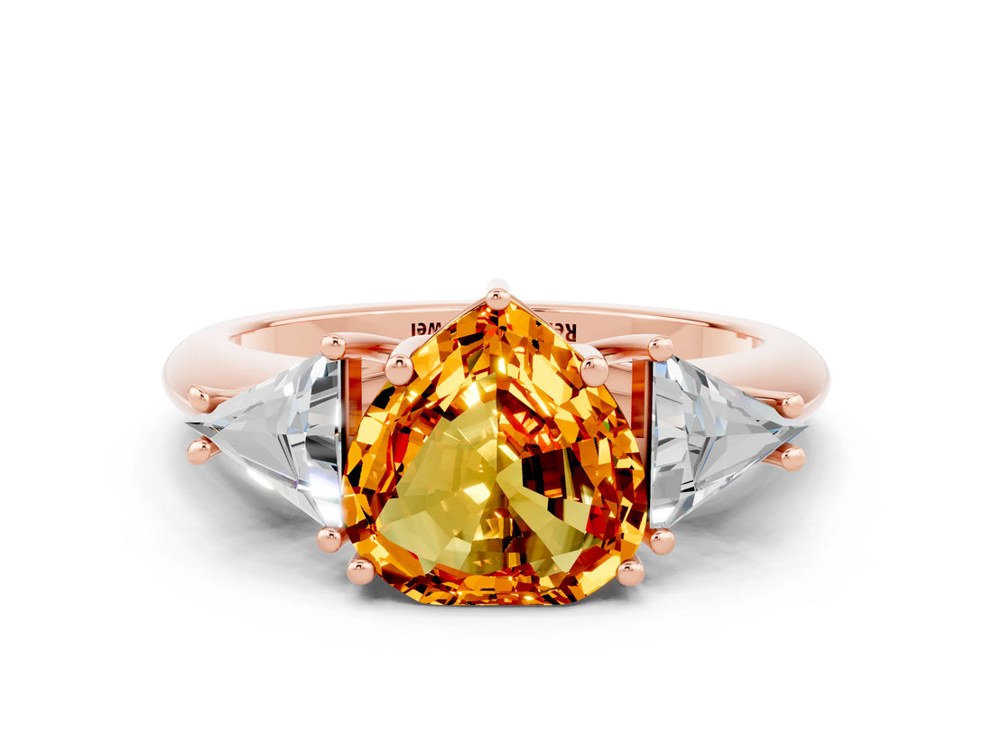 Rose gold Three-Stone Heart Cut Cut Diamond Ring with Trillion Side Stones and Four-Prong Setting