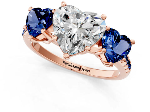 Rose gold Three-Stone Heart Cut Diamond Ring with Round with Blue Sapphire side stone Pavé Band and Prong Setting_1