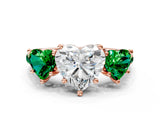 Rose gold Three-Stone Heart Cut Diamond Ring with Round with Emerald side stone Pavé Band and Prong Setting