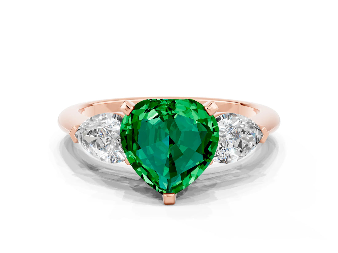 Rose gold Three-Stone Heart Cut Emerald Ring with Pear Side Stones and Four-Prong Setting