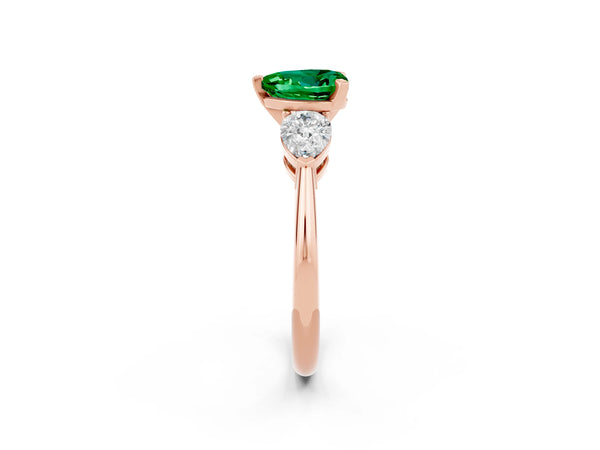 Rose gold Three-Stone Heart Cut Emerald Ring with Pear Side Stones and Four-Prong Setting