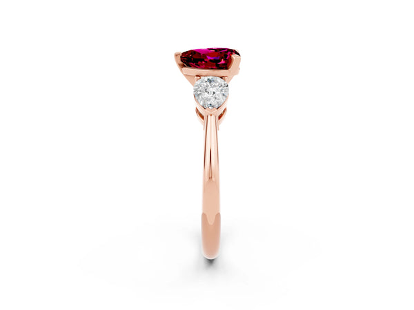 Rose gold Three-Stone Heart Cut Garnet Ring with Pear Side Stones and Four-Prong Setting