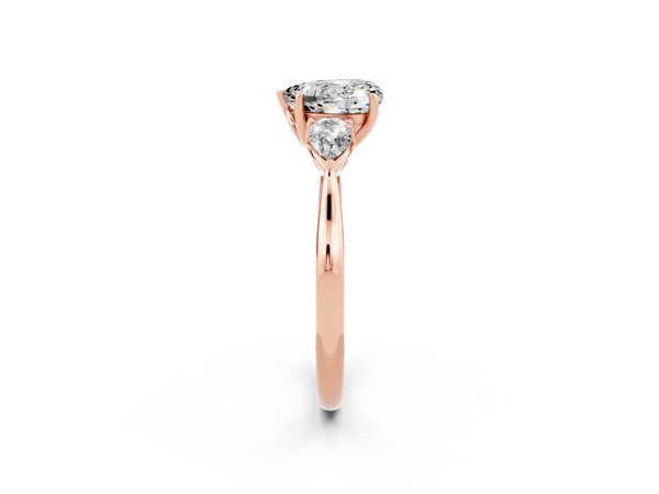 Rose gold Three-Stone Heart Cut Moissanite Ring with Pear  Side Stones in Four-Prong Setting