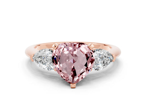Rose gold Three-Stone Heart Cut Morganite Ring with Pear Side Stones and Four-Prong Setting