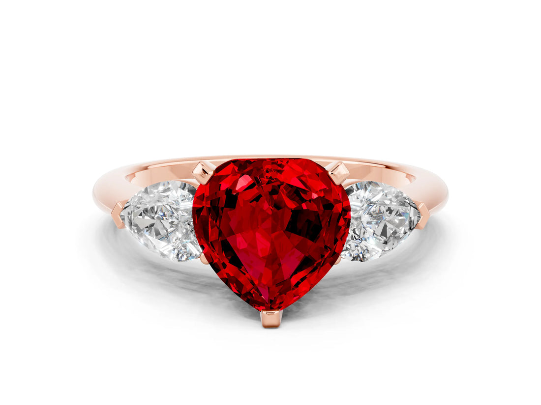 Rose gold Three-Stone Heart Cut Ruby Ring with Pear Side Stones and Four-Prong Setting