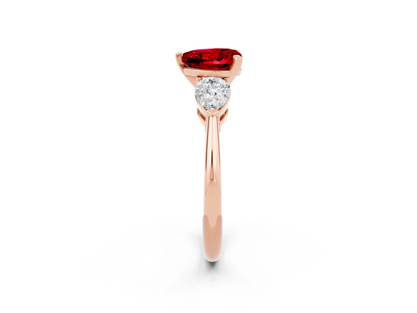 Rose gold Three-Stone Heart Cut Ruby Ring with Pear Side Stones and Four-Prong Setting