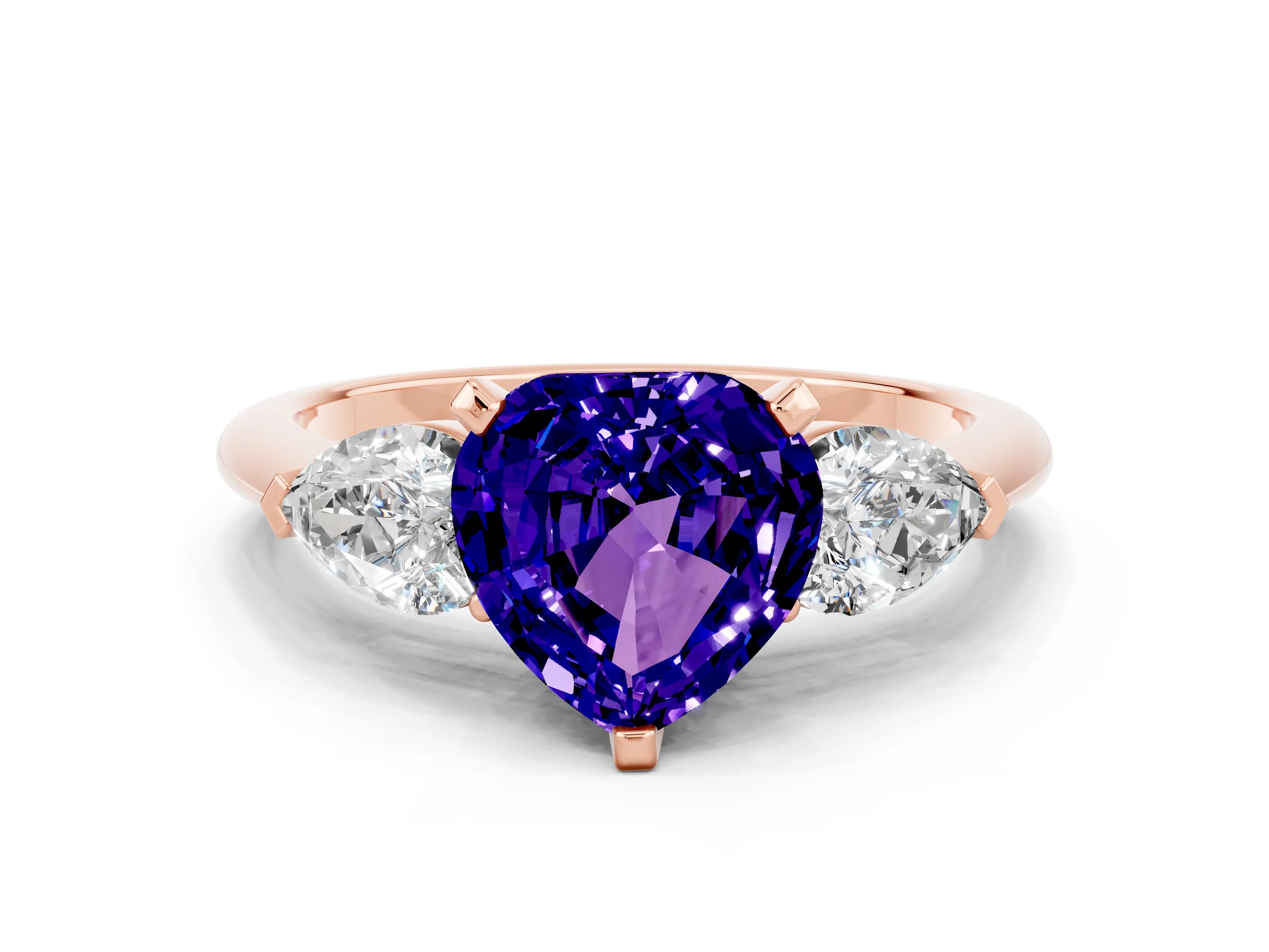 Rose gold Three-Stone Heart Cut Tanzanite Ring with Pear Side Stones and Four-Prong Setting