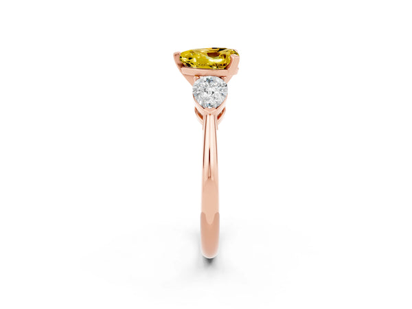 Rose gold Three-Stone Heart Cut Yellow Sapphire Ring with Pear Side Stones and Four-Prong Setting