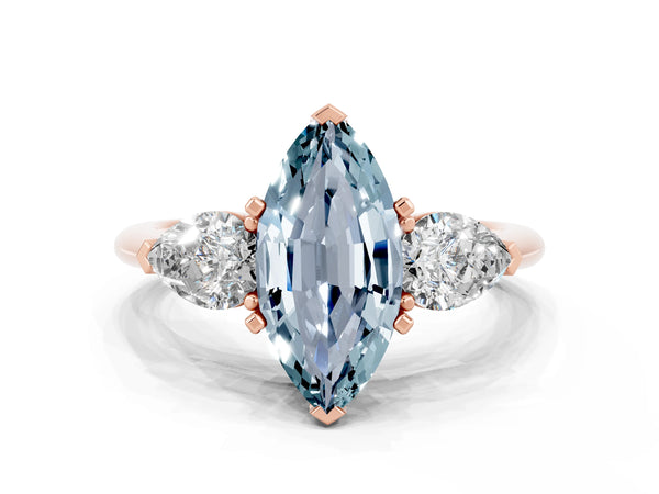 Rose gold Three-Stone Marquise Cut Aquamarine Ring with Pear Side Stones and Four-Prong Setting