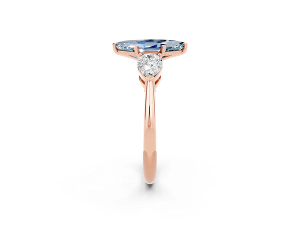Rose gold Three-Stone Marquise Cut Aquamarine Ring with Pear Side Stones and Four-Prong Setting